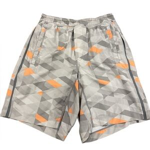 Lululemon men's Pace Breaker shorts with a grey and orange geometric pattern Med